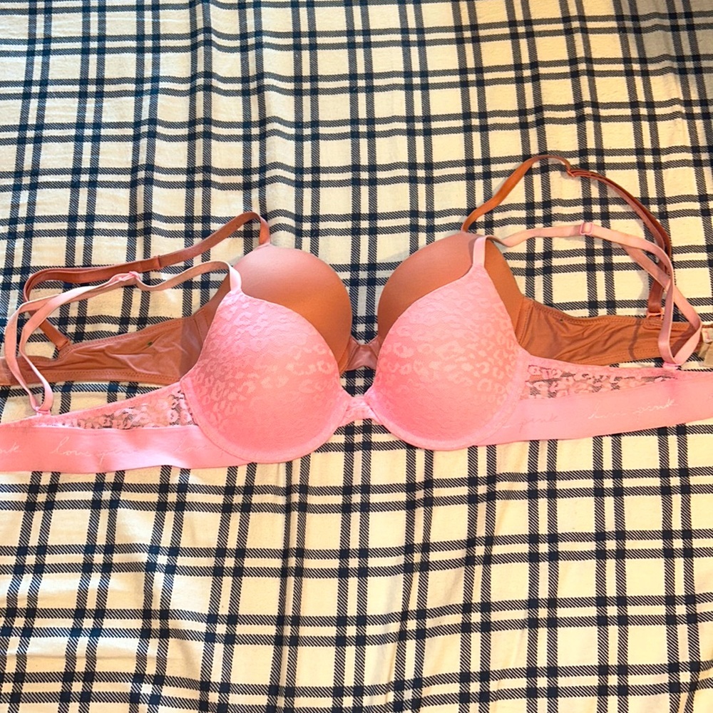 2 pink and mauve bras